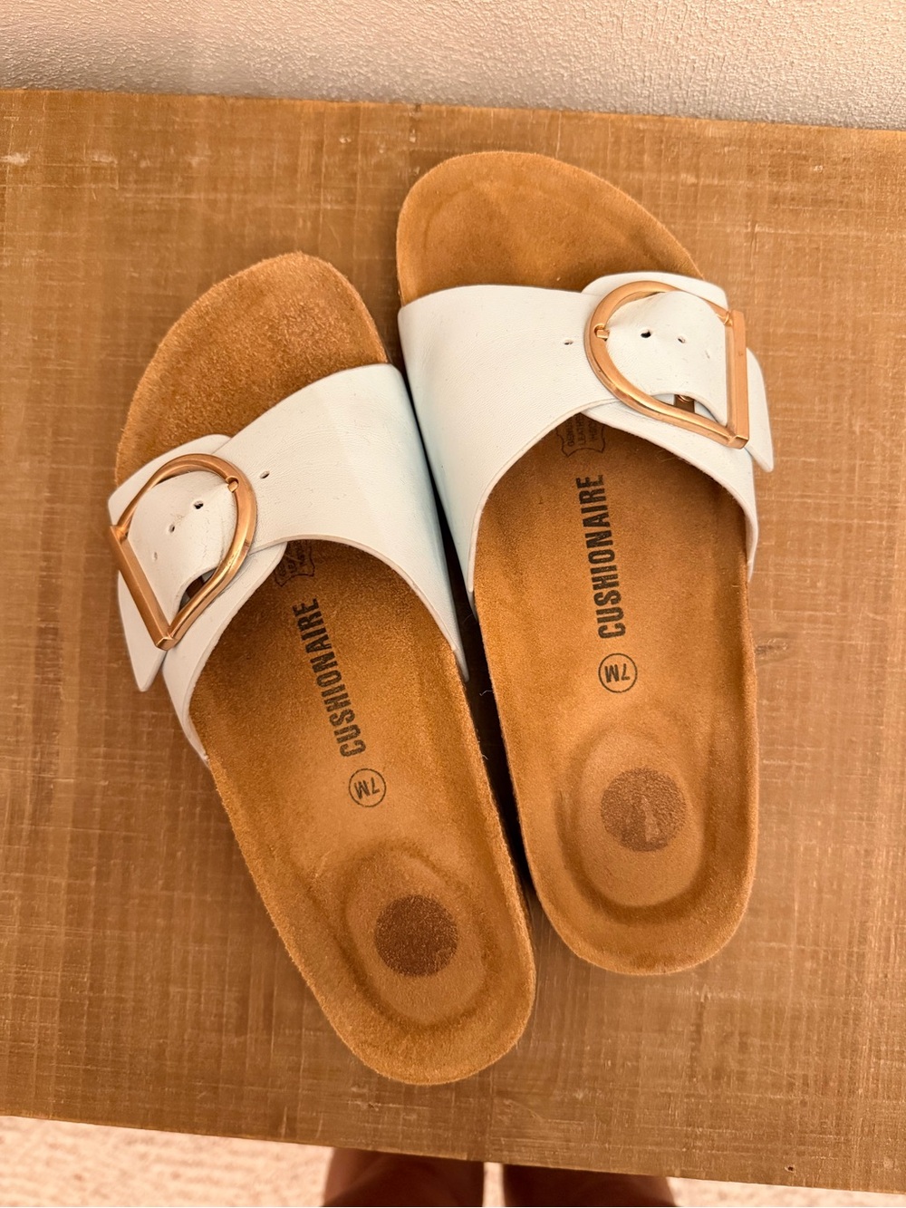 Birkenstock White Slide Sandals with Gold Buckle Accent